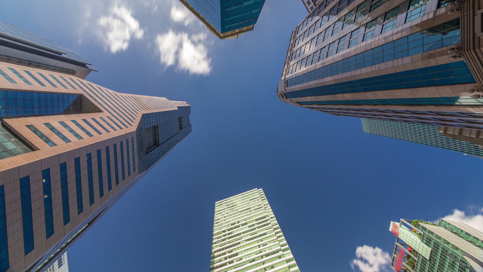 Modern Asian skyscrapers with contemporary glass facades, representing investment and growth